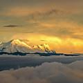 Panoramic view of Antisana volcano during sunset light on misty cloudy day
